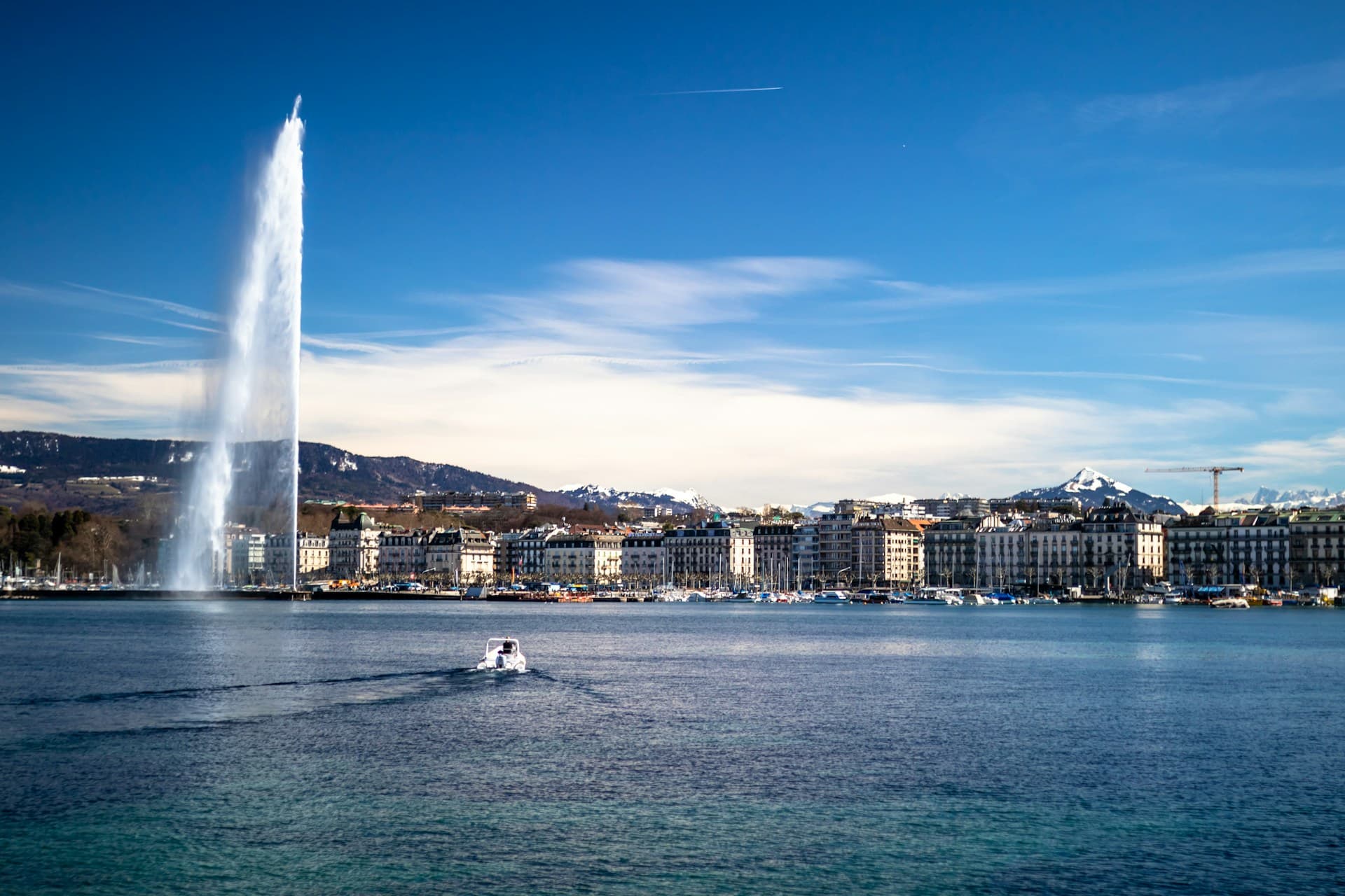 Lake Geneva and the Jet d Eau with the Alps behind