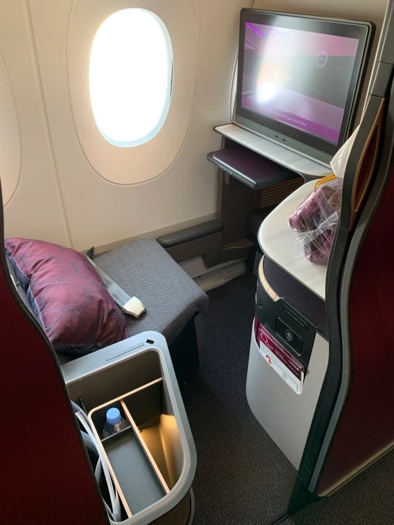 Reverse herringbone business class cabin with 1-2-1 seats angled toward the windows