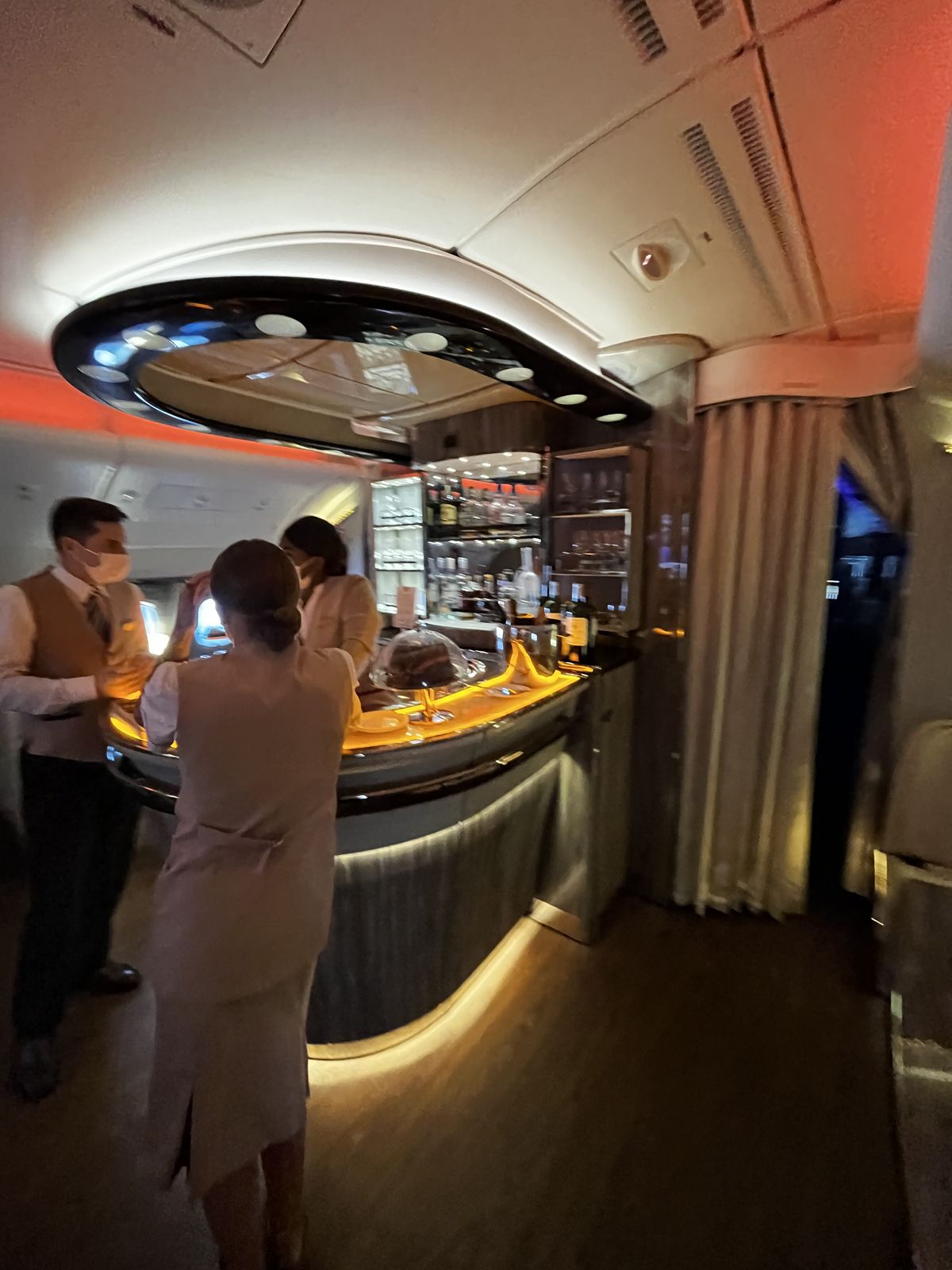 Onboard bar in a business class cabin during a night flight